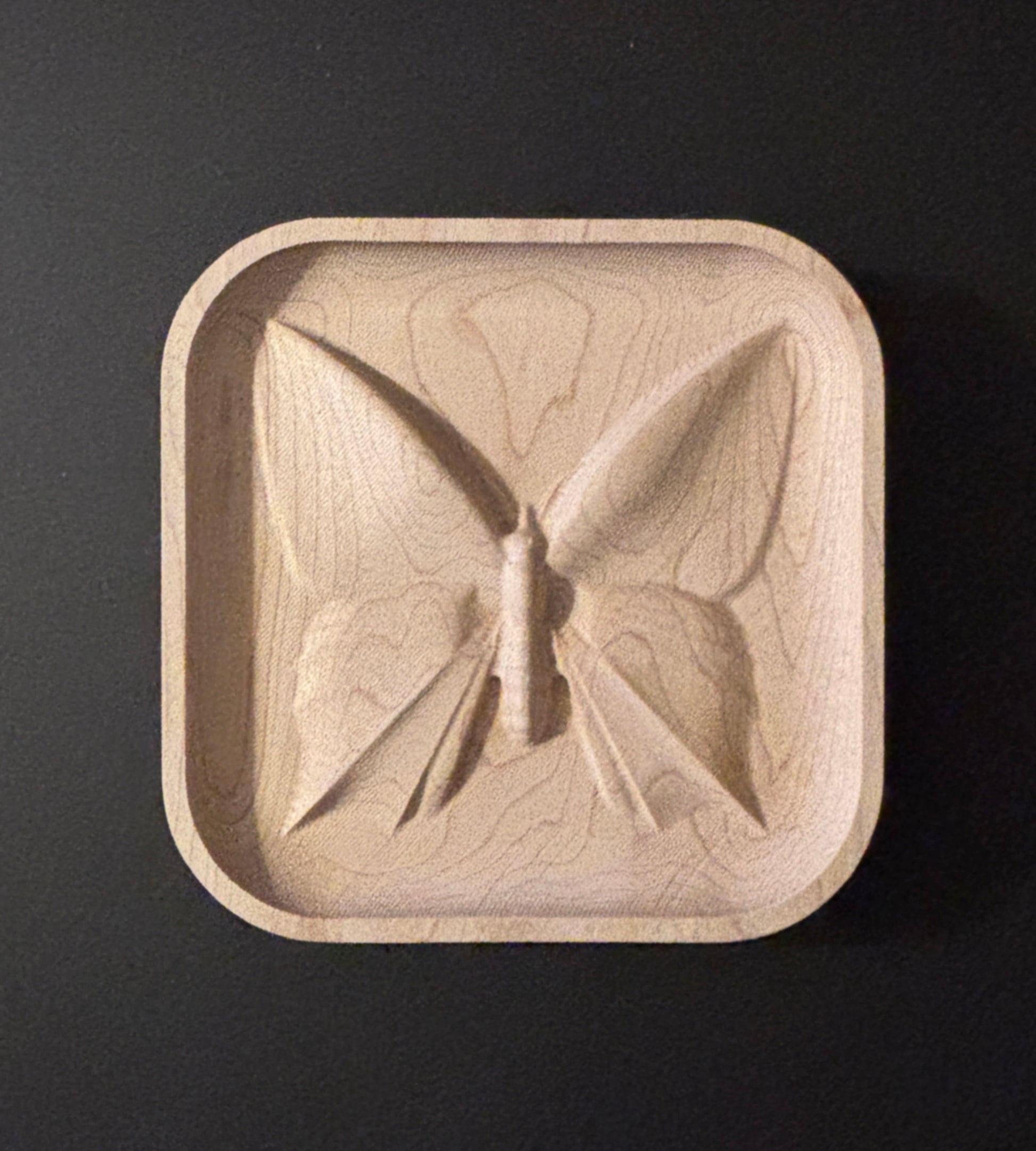 Wooden dish with butterfly design.