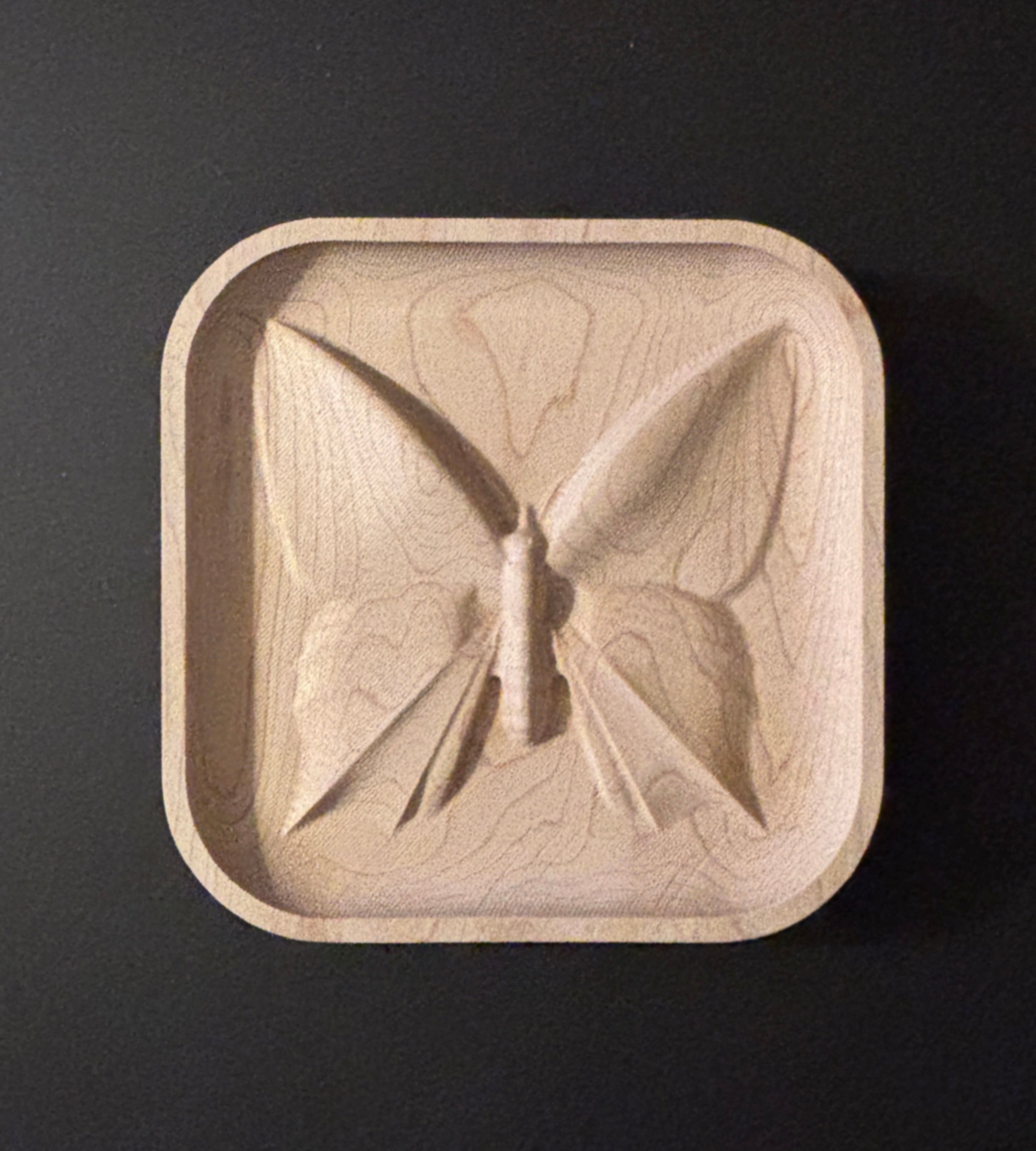 Wooden dish with butterfly design.