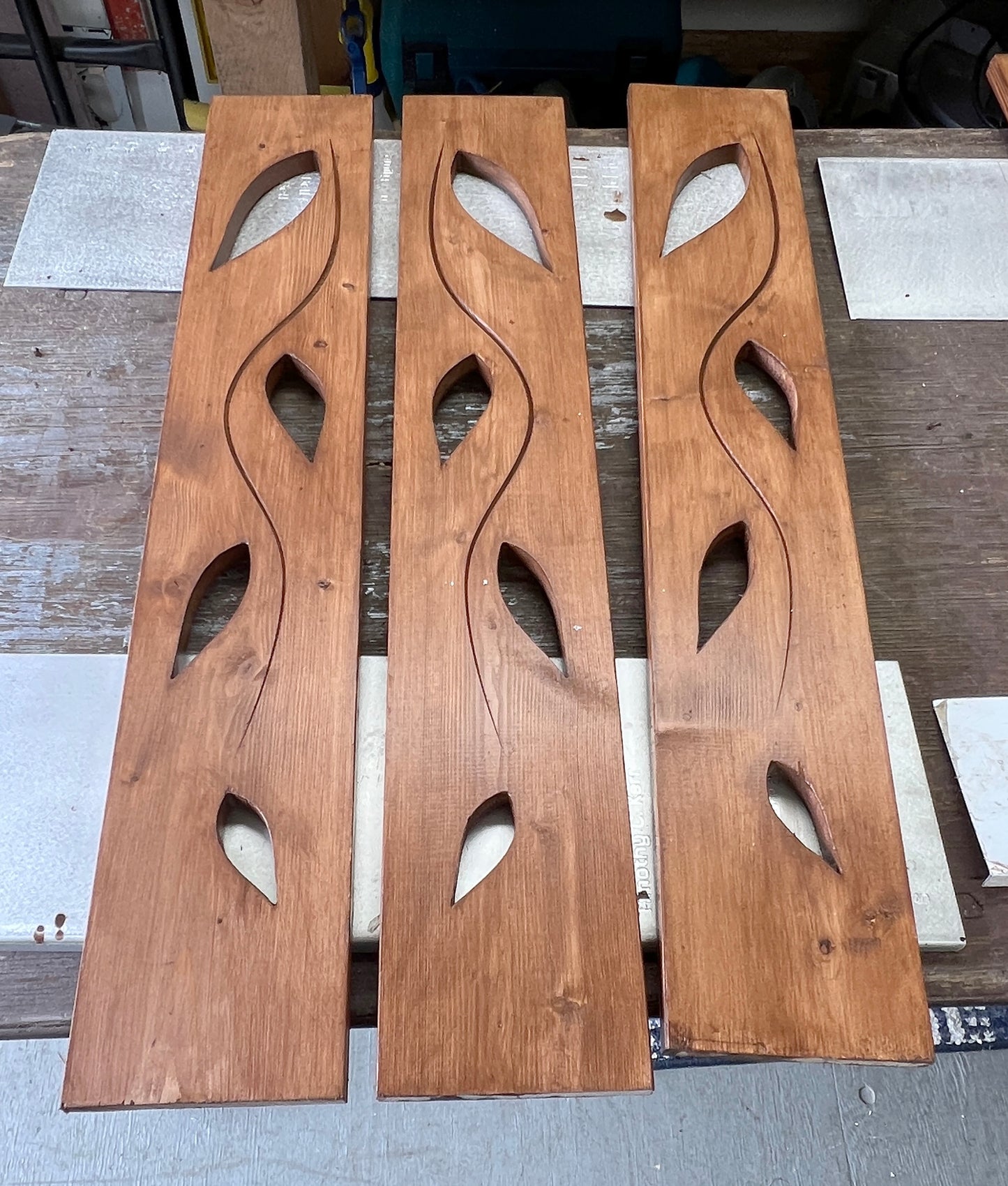 Wooden panels with cut-out designs.