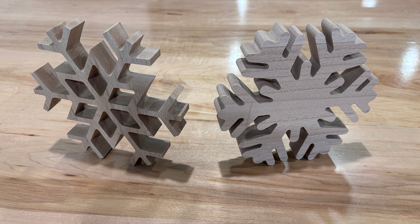 Two wooden snowflake ornaments